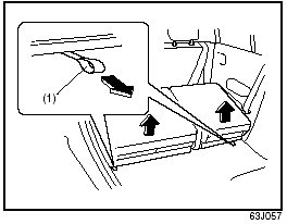 5) Pull the lock release strap (1) rearward