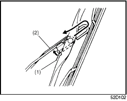 2) Squeeze lock lever (1) towards wiper